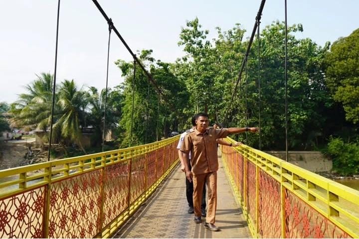 Menjaga dari Ujung Dusun IV Muara Tiku: Perjalanan Feri Memastikan JKN Menjangkau Suku Anak Dalam